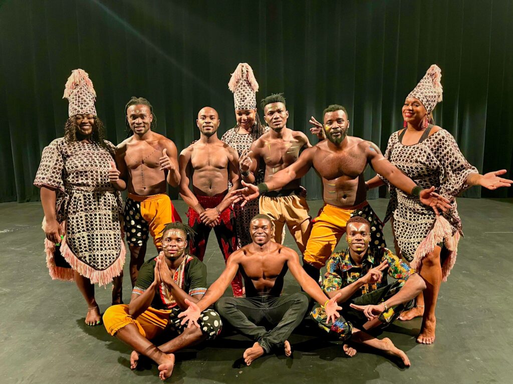 A photo of the full crew on the Zuzu African acrobats team.