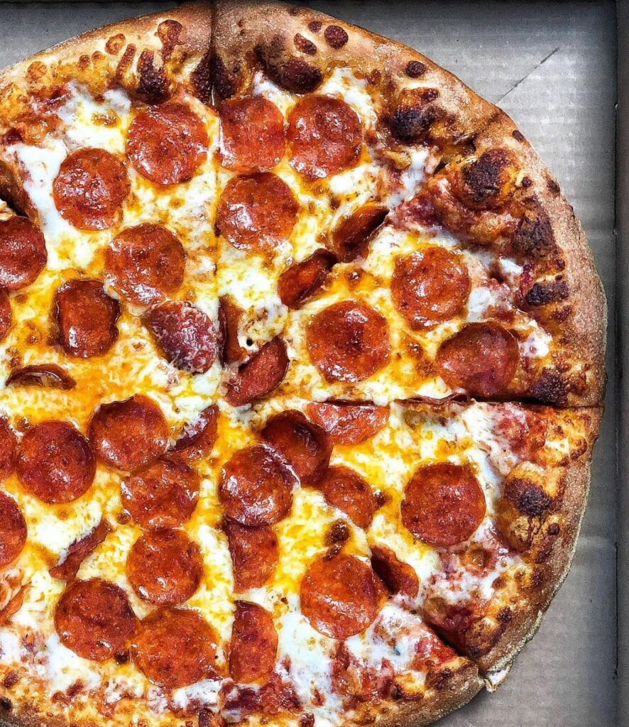 Enjoy the delectable satisfaction of a perfectly made pepperoni pizza from the well-known Stoner's Pizza establishment.