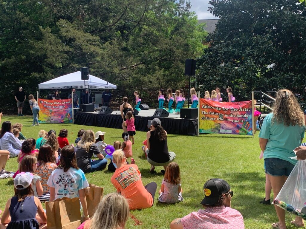 The community watches as the dance school students perform a showing at Artsfest.