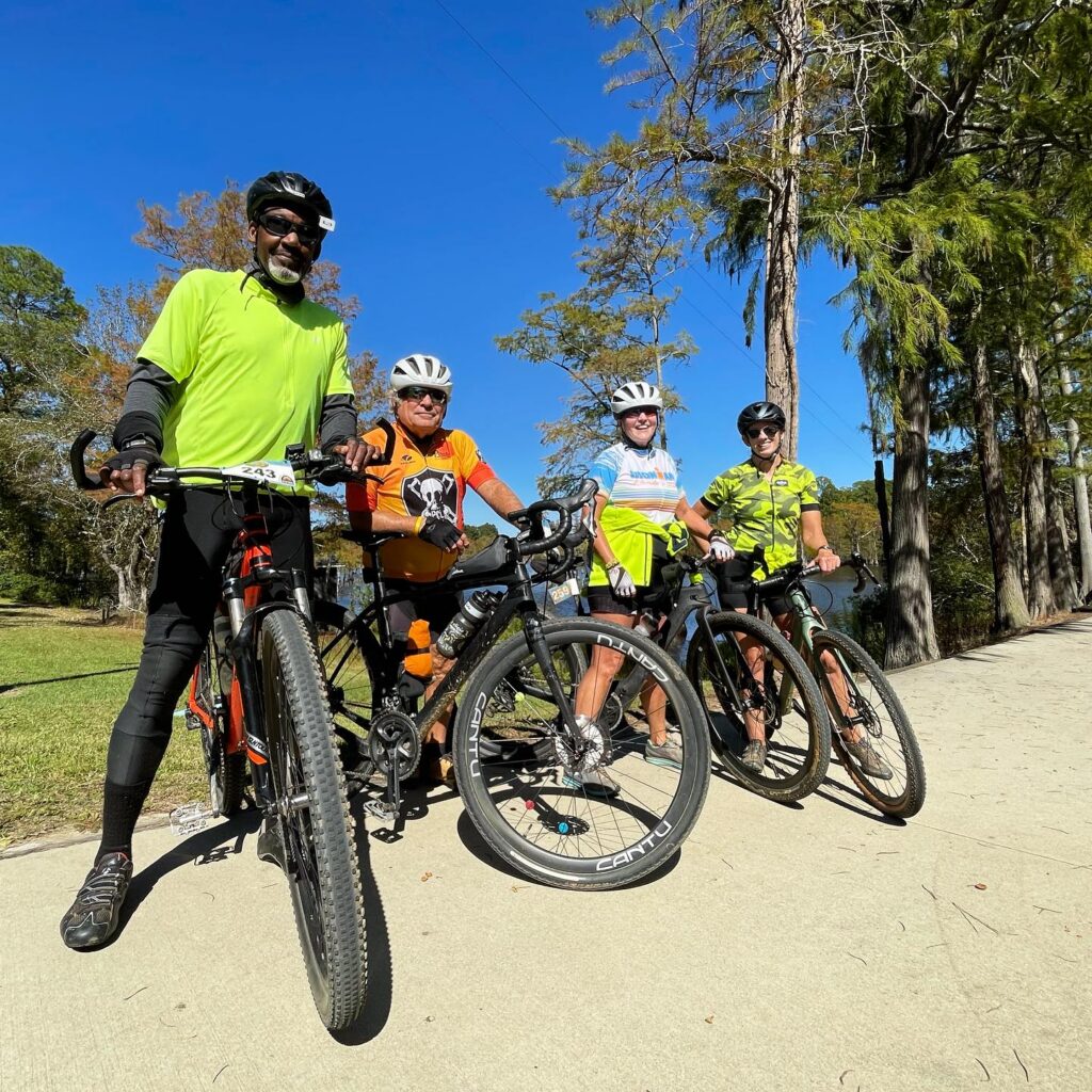 4 bikers strike a pose, radiating their excitement for the thrilling Hi-Lo Trail adventure! A grueling 2 day 3 night bike ride!